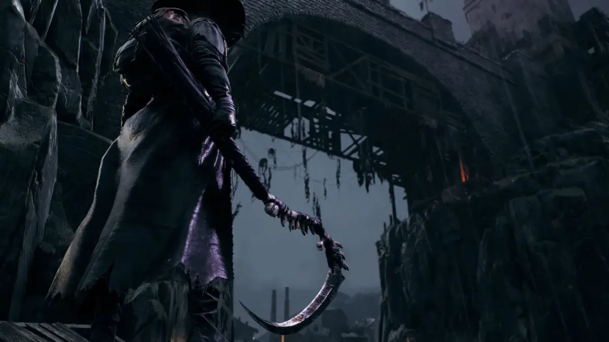A character stands in a trenchcoat holding a giant hook in Remnant 2.