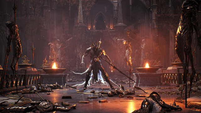 An enemy creature holding a staff standing above fallen soldiers in Remnant 2.