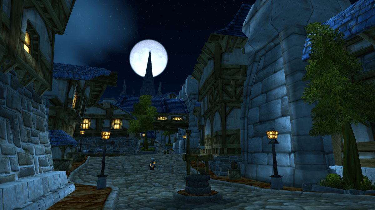 A WoW screenshot of the moon rising over Stormwind City's Trade District in WoW Classic.