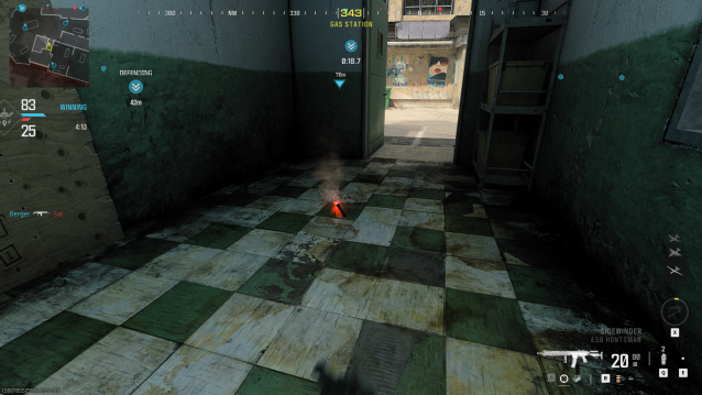 A red flare on the ground in a building in Modern Warfare 3.