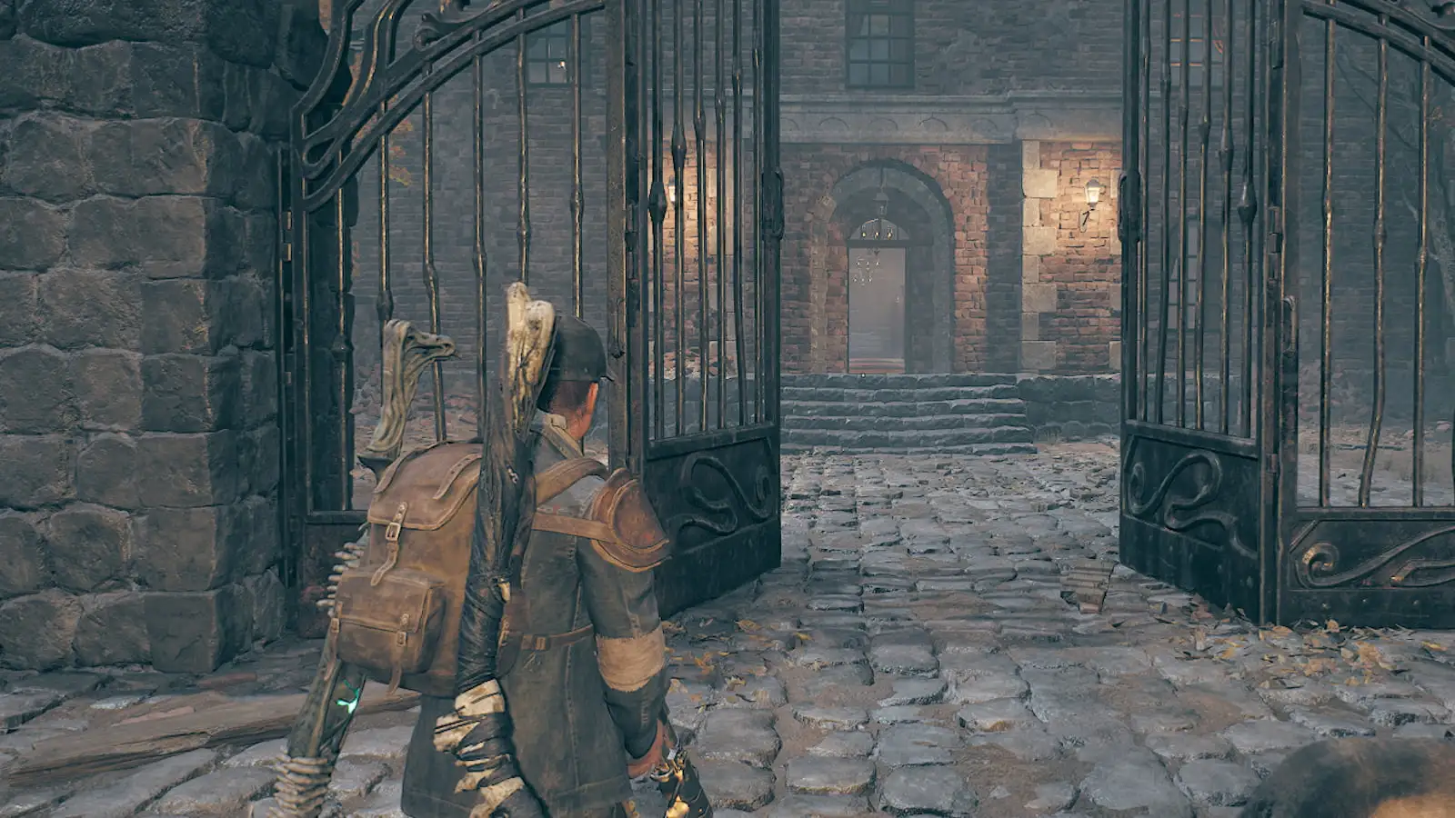 The player standing in front of an open gate in Remnant 2.