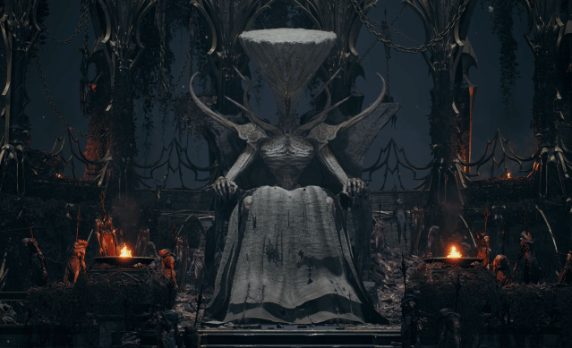 A screenshot from Remnant 2’s The Awakened King DLC showing a statue of the mad king sitting in a chair in a dark cathedral.