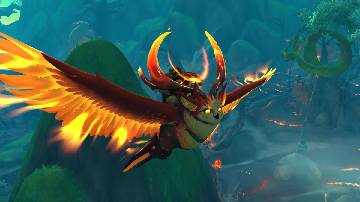 WoW character riding a fire owl mount in the Emerald Dream