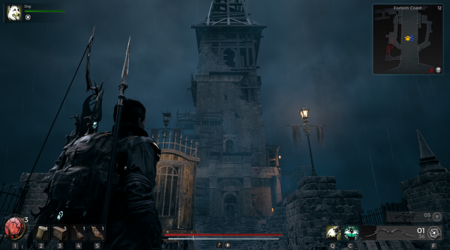 A screenshot from Remnant 2 showing a person standing and looking up at an abandoned tower in front of a dreary background.