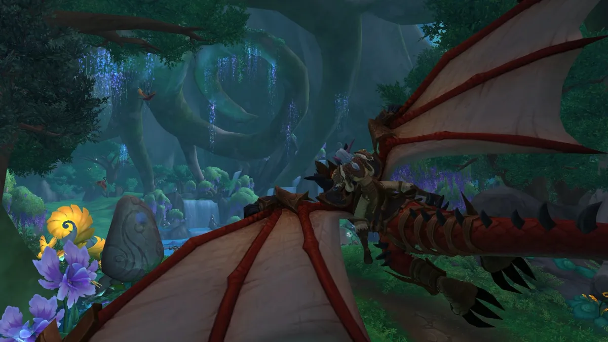 WoW character flying on a Dragonriding mount in the Emerald Dream