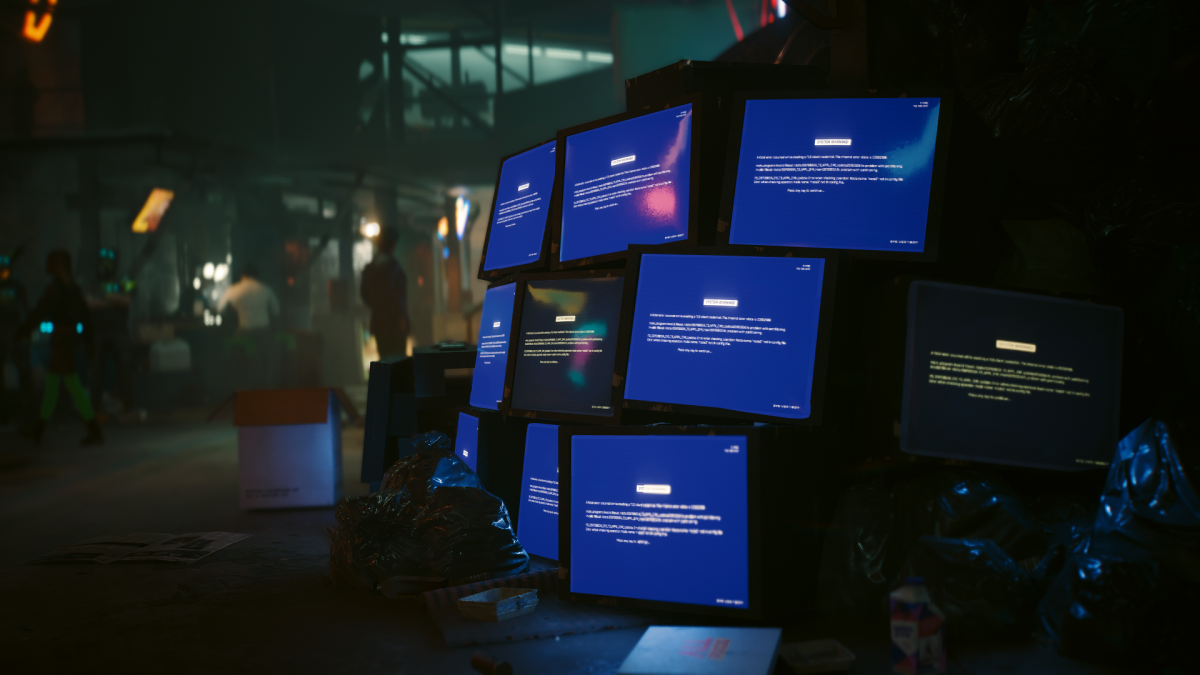 A pile of bluescreened computer monitors in Cyberpunk 2077