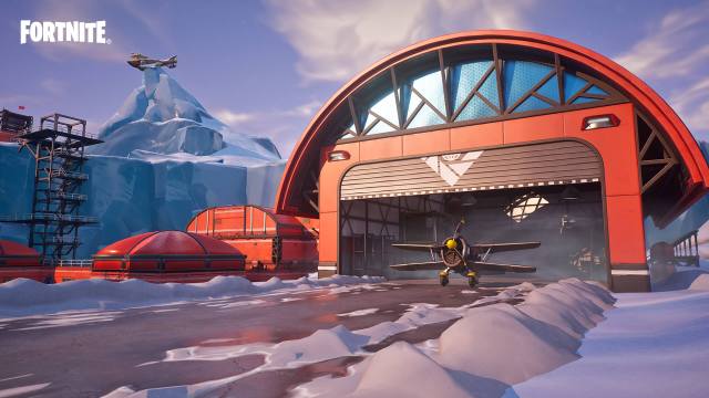 Fortnite's Frosty Flights POI, with an X-4 Stormwing plane sitting in a red hanger.