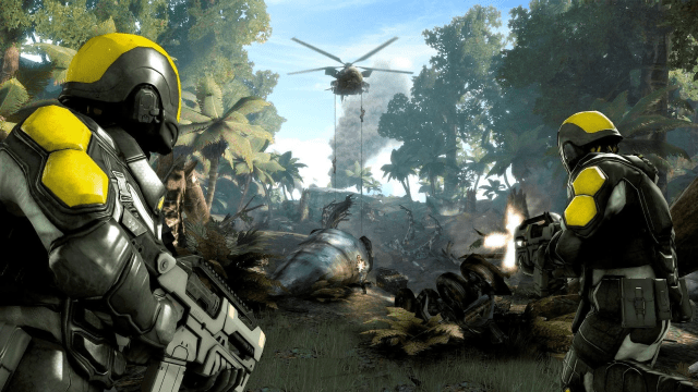 Two soldiers in black and yellow armor use machine gun weapons to fire at enemies rappelling down from a hovering helicopter.