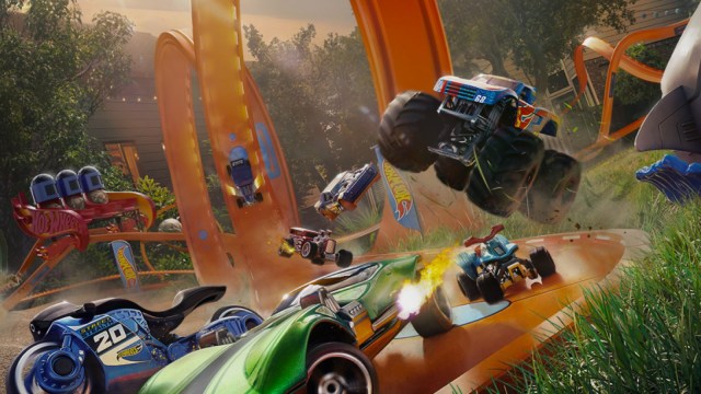 A promotional image of Hot Wheels Unleashed 2 showing cars on the iconic orange track.