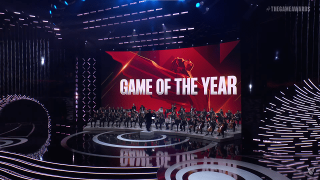 Orchestral band behind a stage showing Game Of The Year at 2022's The Game Awards show. Screenshot via The Game Awards YouTube.