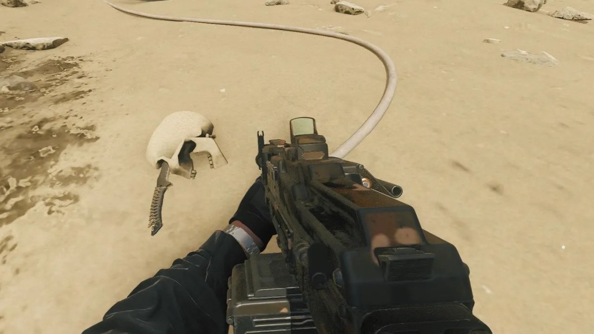 A close up of a character holding a gun in the direction of a skull in mw3