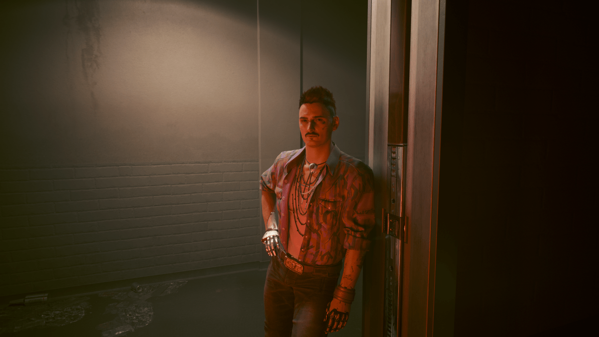 Dante leaning in a doorway of an apartment building in Cyberpunk 2077.