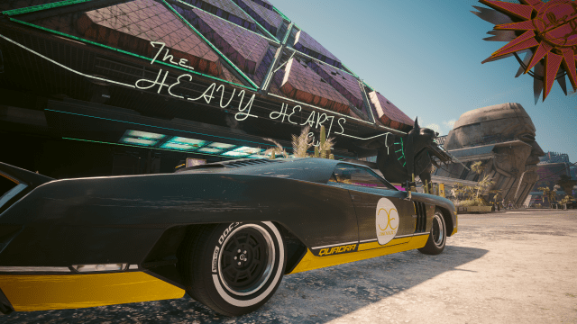 The R7 Charon sports car parked outside of Heavy Hearts Club in Dogtown (cyberpunk 2077).