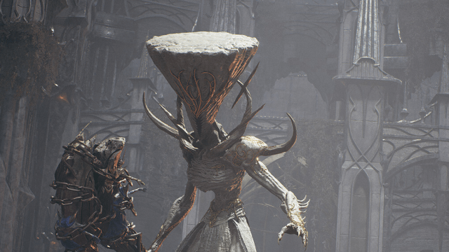 A massive creature with a club and a cone-shaped, flat head stands in front of a palace in in Remnant 2.