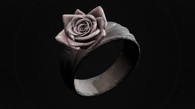 A silver ring with a silver flower on one side sits on a black background in Remnant 2.