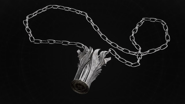 A silver cylinder on a silver chain sits on a black background in Remnant 2.