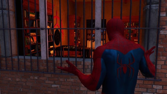 Spider-Man shrugs while looking into a mysterious building in Spider-Man 2's Upper West Side.