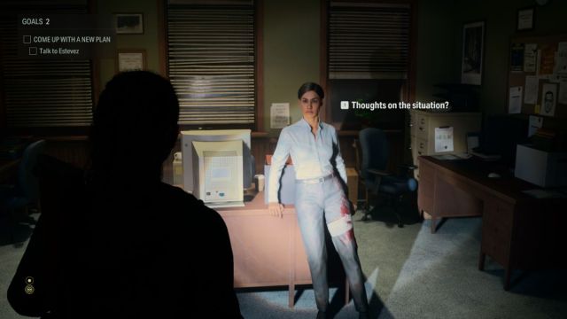 an in game screenshot of Saga speaking with Estevez in Alan Wake 2.