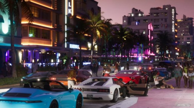 There is a shot of Vice City at night. There is a lot of traffic on the strip.