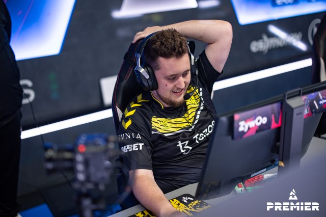 ZywOo, a Counter-Strike player for Team Vitality, sits at a computer playing at a BLAST event.