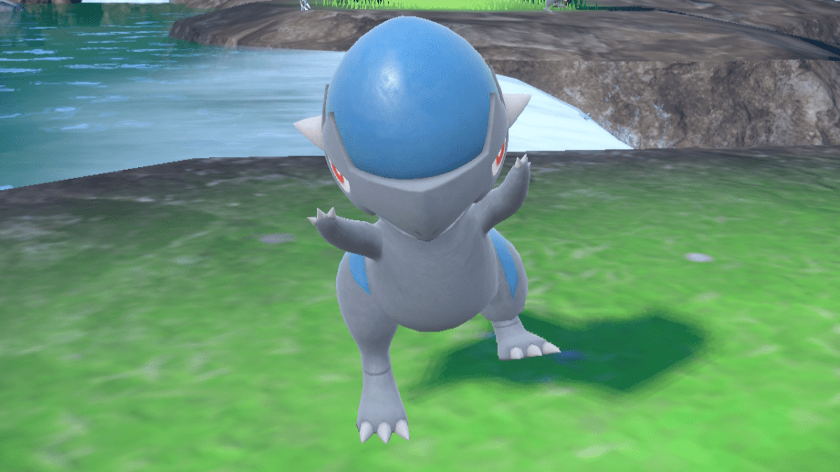 Cranidos, a baby dinosaur-like Pokemon, dances in front of a river.