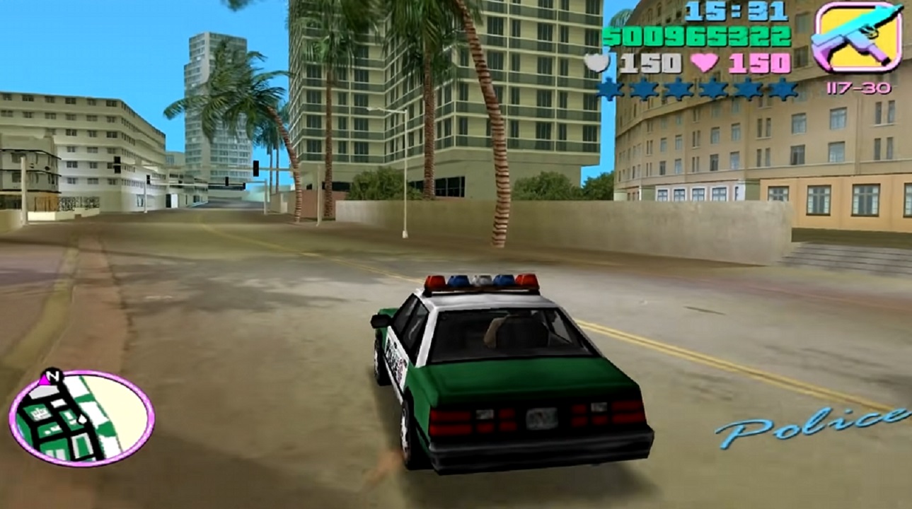 There is a shot of a cop car in Vice City. There are buildings in the distance.