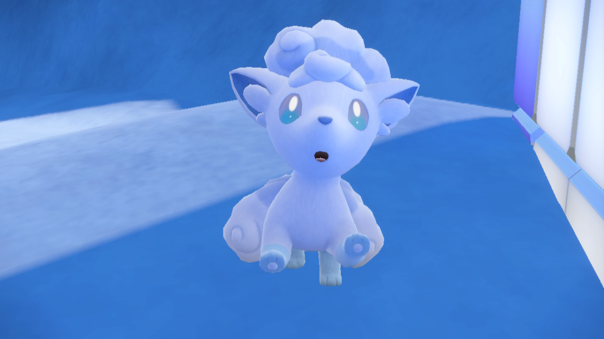 A screenshot from Pokemon Scarlet and Violet The Indigo Disk with Alolan Vulpix, a white fox creature, jumping in joy.