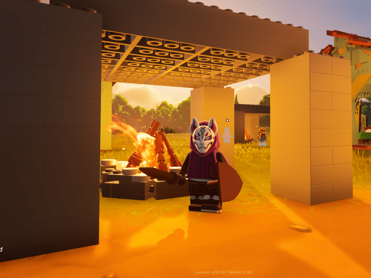 A LEGO Fortnite player character stands near a campfire.