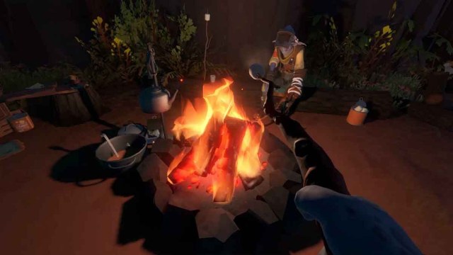 Toasting a marshmallow on a campfire with an alien in Outer Wilds
