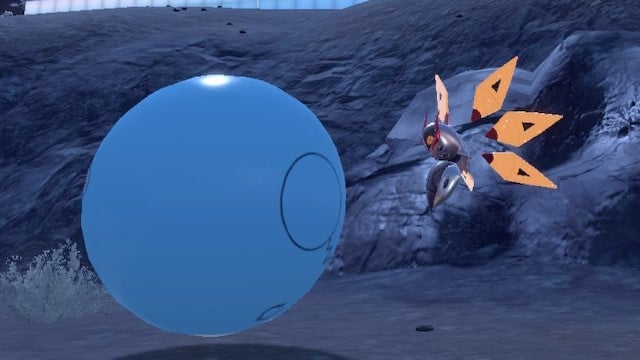 A mechanical Iron Moth looks at a blow-up ball in Pokémon Scarlet and Violet.