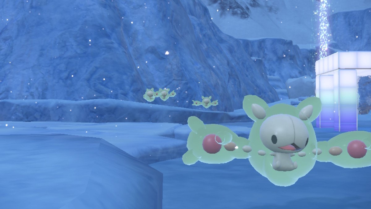 A group of Reuniclus float along the frozen terrain of Pokémon Scarlet and Violet.