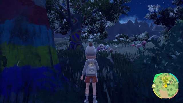 Trainer standing in Tagtree Thicket at night in Pokémon Scarlet and Violet.