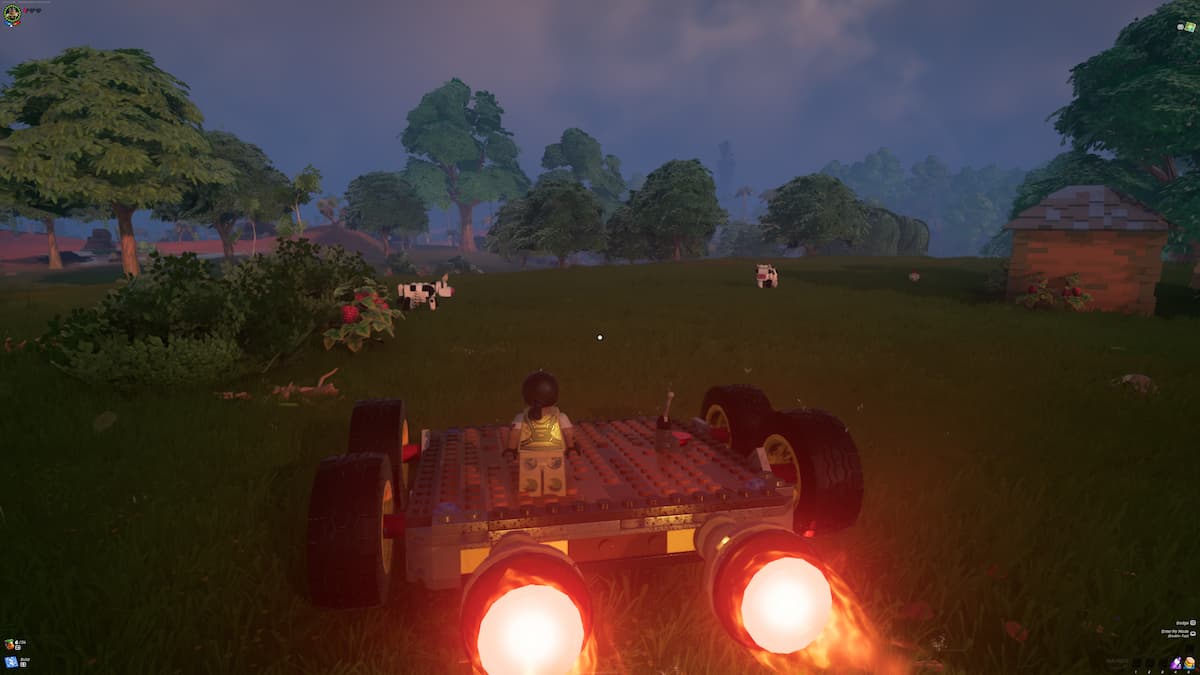 A Lego Character is driving a car at night in Lego Fortnite