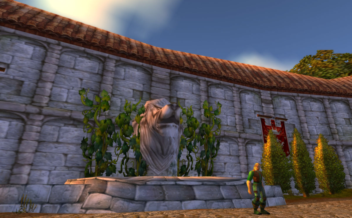 WoW Classic, entrance to Northshire Abbey featuring a human NPC and a fountain