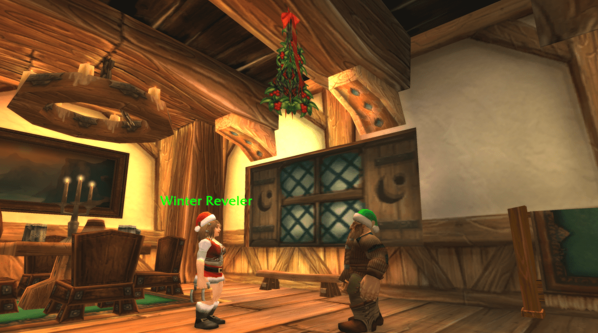 Two Winter Revelers stand under some Mistletoe in the Wetlands, Menethil Harbor, in WoW Classic