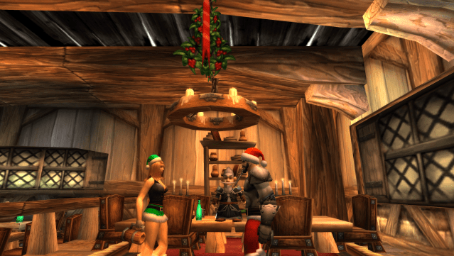 Two human Winter Revelers stand under the Mistletoe in WoW classic in Southshore, Hillsbrad Foothills