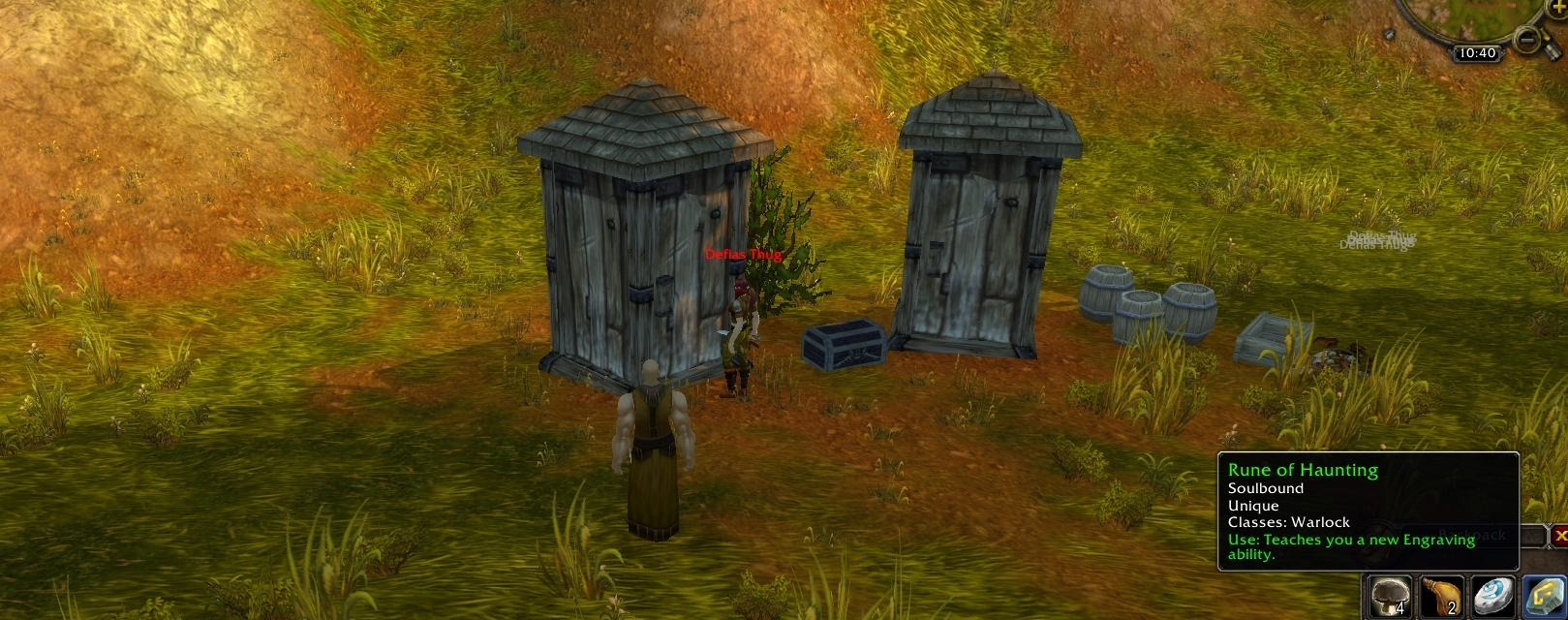 Two buildings, a thug, and a chest containing the Rune of Haunting