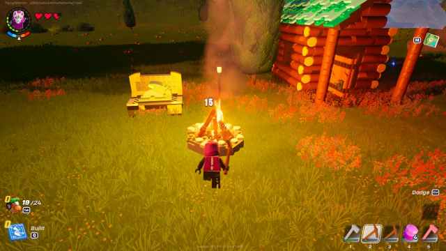 LEGO Fortnite character swinging a pickaxe at a campfire