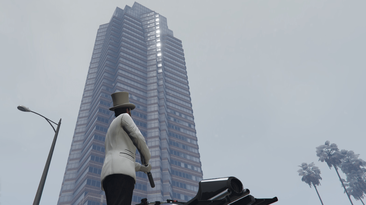 A GTA Online player looking up at Weazel Plaza.