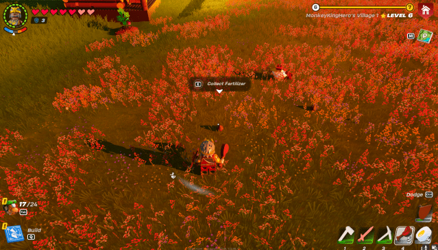 A LEGO Fortnite character in a field approaches a small mound of Fertilizer.