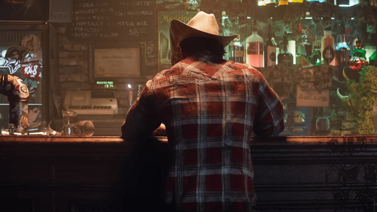 A guy seen from the back in a bar.
