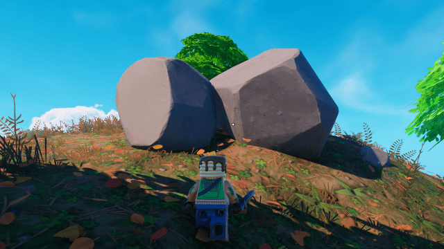 Two large stones on top of a hill in LEGO Fortnite.