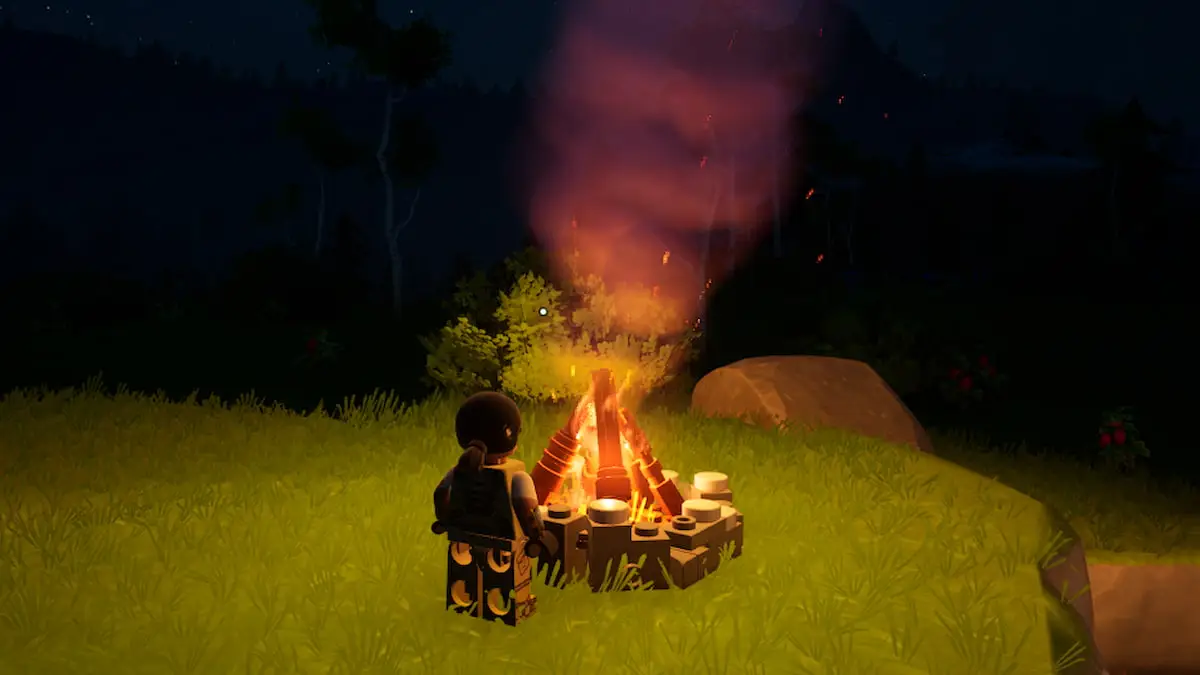 A LEGO Fortnite player in front of a campfire during the night.