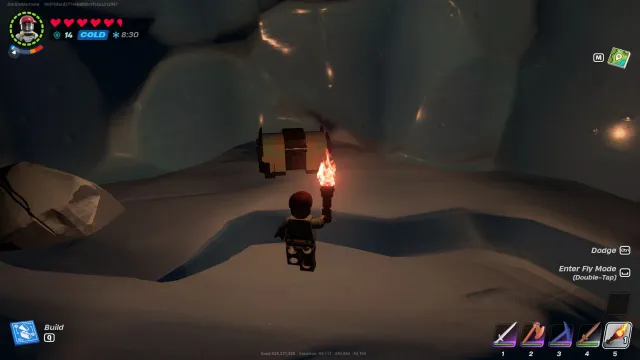 A chest inside a snowy cave in LEGO Fortnite
