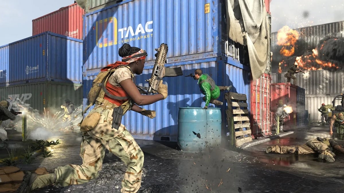 There is a shot of players fighting each other on the map Shipment. There are explosions going on and players shooting each other.