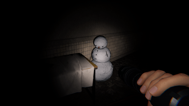 A snowman pointing toward the second mysterious part.
