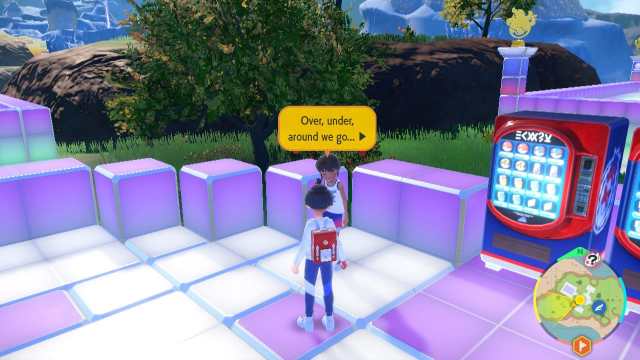Screenshot from Pokémon SV showing a player character facing an NPC with a dialogue above their head, standing in an area with a vending machine nearby.