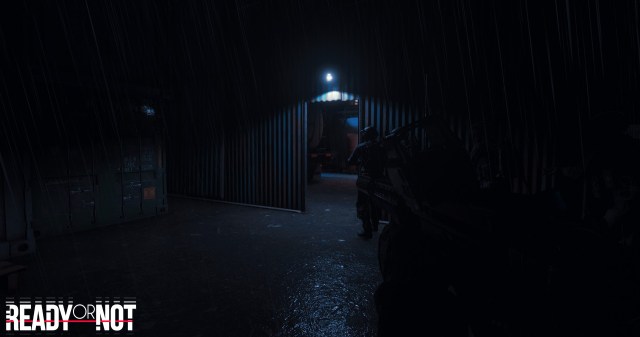 Two players walking into a hangar with a bulb lighting the entrance in Ready or Not