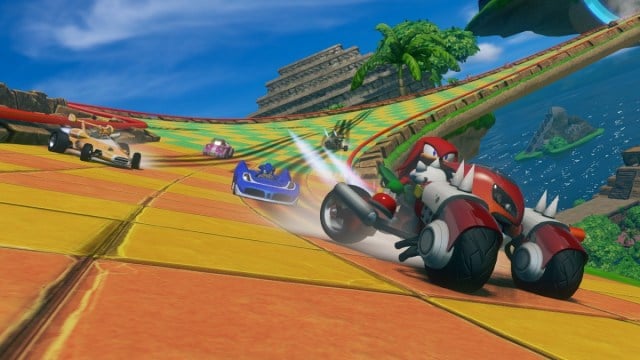 Sonic and All-Stars Racing Transformed Knuckles Tails Amy driving on Super Money Ball race track
