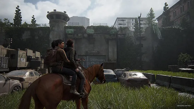 An in game screenshot of Ellie and Dina on horseback from The Last of Us Part 2 Remastered